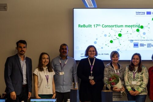 ten people in front of a projector screen
