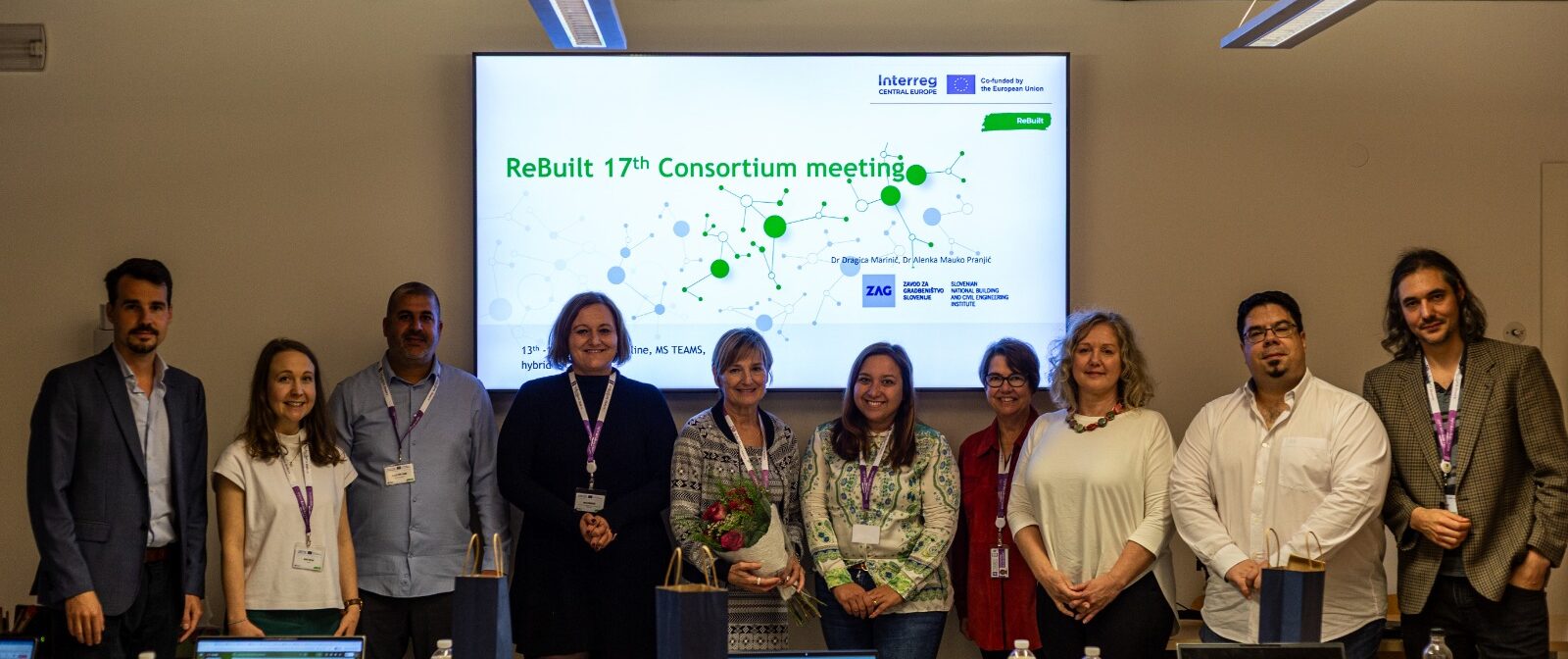 ten people in front of a projector screen