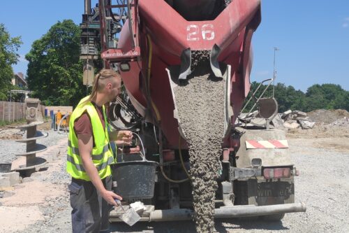 fresh concrete beeing poured