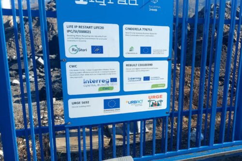 blue fence with logos