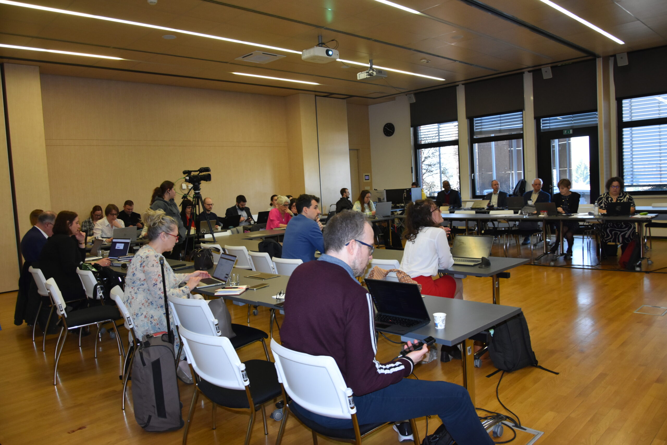people sitting in a conference room